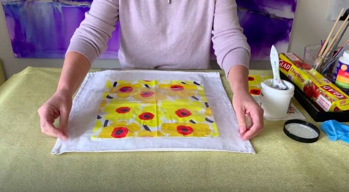 create a diy decorative pillow using napkins and glue, Add Plastic Wrap