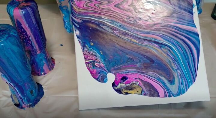 upcycle old jars with this acrylic pour candle project, Tilt the Canvas