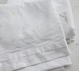 Use old & stained tablecloths to beautify your bare couch