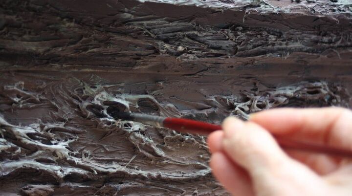 realistic bark texture with caulk and a fork easy flower box makeover