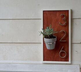 9 sleek house number ideas that ll turn heads on your block, Use a large pipe clamp to add a little flower pot