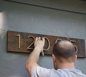 9 sleek house number ideas that ll turn heads on your block, Spay paint numbers gold stain a single board to get this sleek look in no time