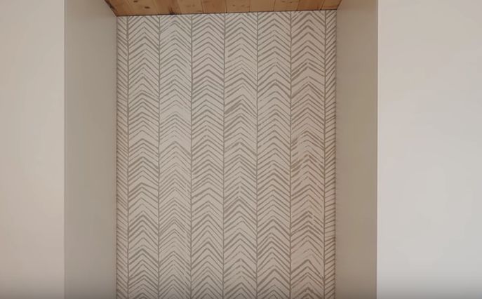 s 13 herringbone projects that you ll be obsessed with, Hand Stamped Herringbone Accent Wall