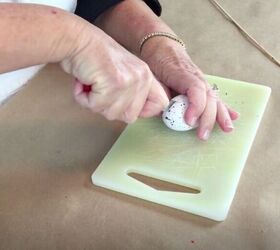 She cuts a few styrofoam Easter eggs in half for this beautiful door accent