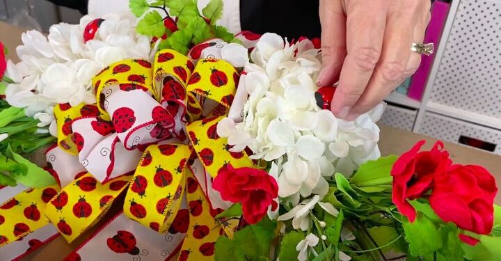 brighten up your front door with this diy ladybug wreath, Glue on Flowers