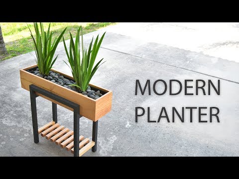 make your front yard stand out with these 15 diy planter box ideas, Make a modern raised planter box