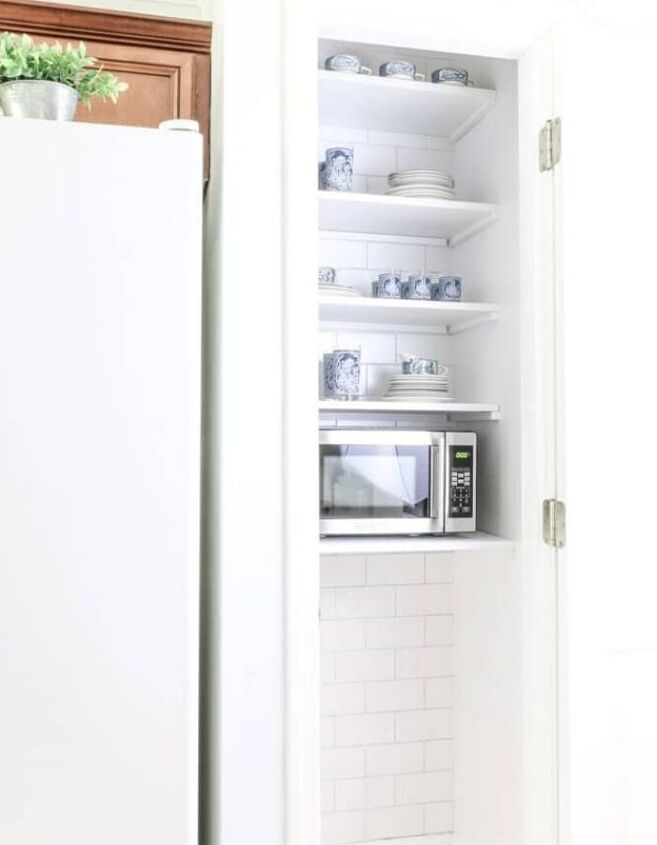 s 10 genius kitchen storage ideas that are better than cabinets, Hidden Microwave Storage