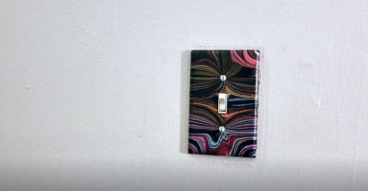 update your light switch plates with this simple paint pour project, DIY Decorative Light Switch Plates