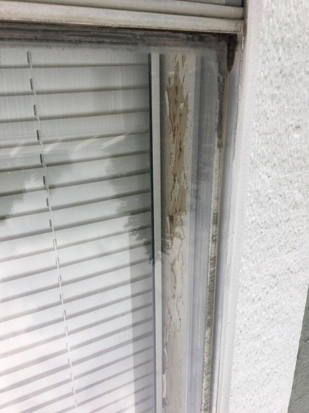 how do i repair peeling wallpaper between my mobile home windows