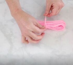how to make yarn tassels, Tie the Yarn