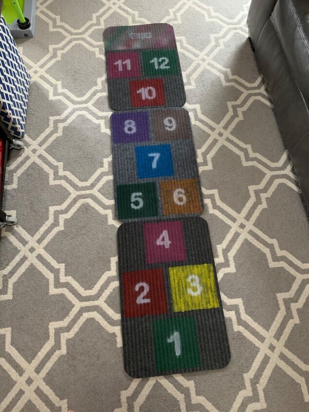 s 9 fun diys that ll keep the kids active during summer vacation, Use cheap rugs to make an indoor hopscotch game