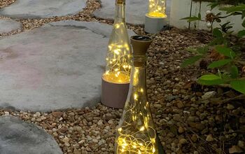 Luces para botellas de vino DIY con bonitas bases de cemento