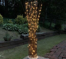 diy twig lights stand in a floating concrete base