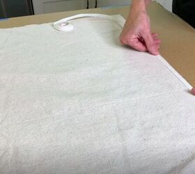 stamp your way to a beautiful drop cloth rug, Add Hemming Tape