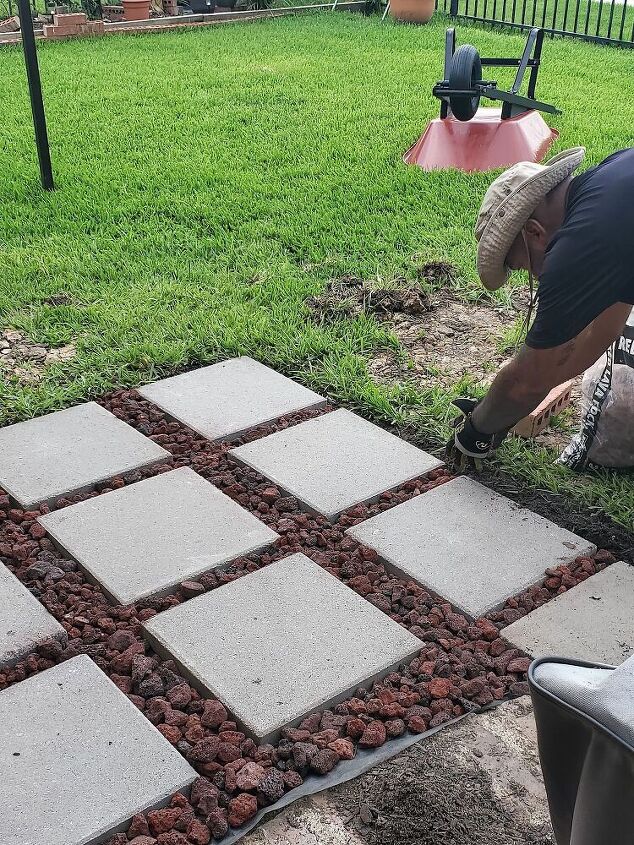 add lava rock, river rock, grass or herbs between the pavers of the grill landing pad