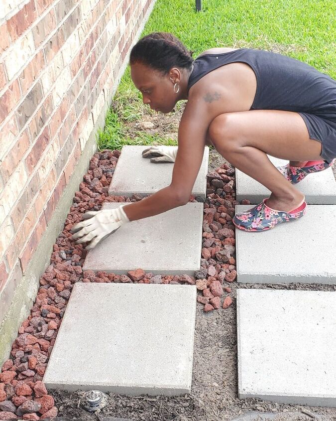 add lava rock, river rock, grass or herbs between the pavers of the grill landing pad