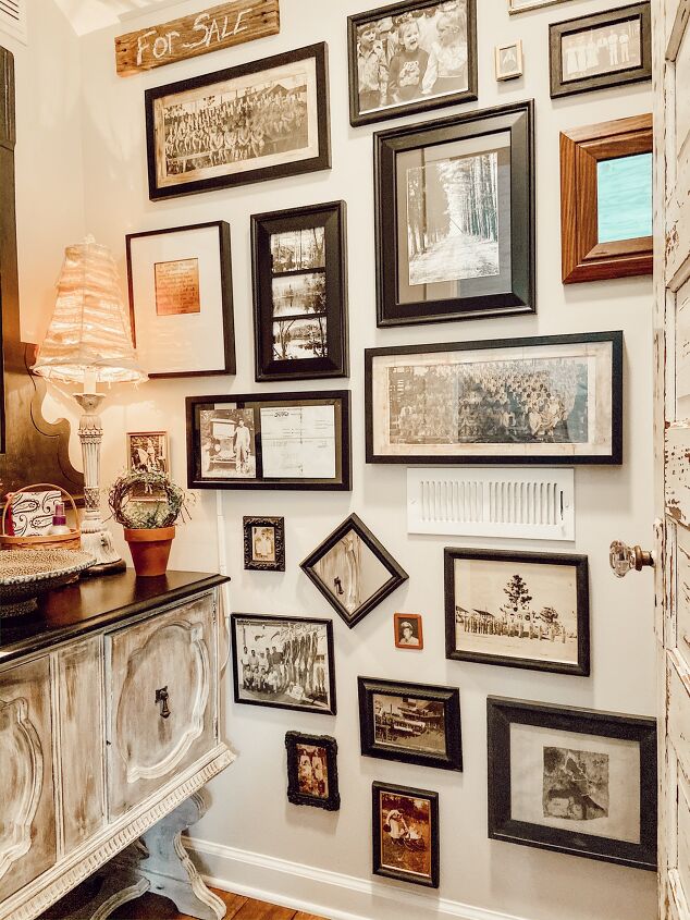 s 11 ways to make vintage decor using items your probably already own, Use all your old boxed up photographs to make a gallery wall
