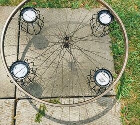 Turn a bicycle rim and 4 dollar store lights into beautiful outdoor lighting