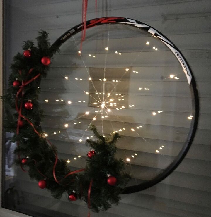 s 12 reason why you really shouldn t toss that old bicycle, Repurposing Bicycle Wheel Holiday Wreath