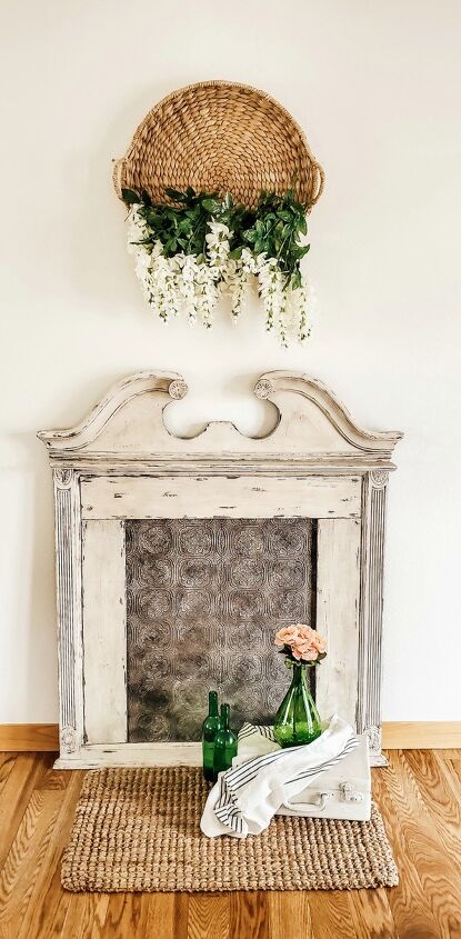 s 9 spellbinding faux fireplaces that are making us miss the winter, Antique Style Mirror Turned Faux Fireplace