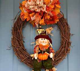 s start planning your prettiest fall porch yet with these 10 ideas, A Little Scarecrow With a Gift