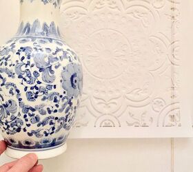 She holds a vase against her bathroom floor for this breathtaking makeover