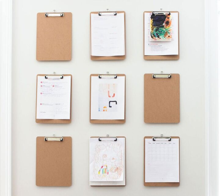 s 28 easy organizing ideas to keep you sane throughout the school year, Design and Hang a Clipboard Wall to Display A