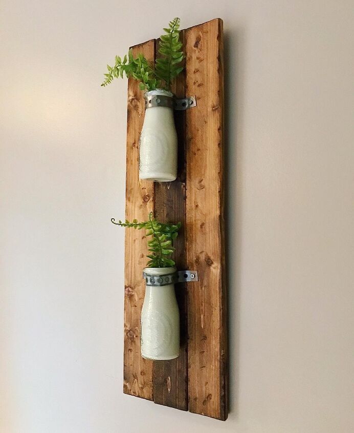 32 charming farmhouse decor ideas you can diy for 30 or less, Farmhouse Milk jug Wall Hanging