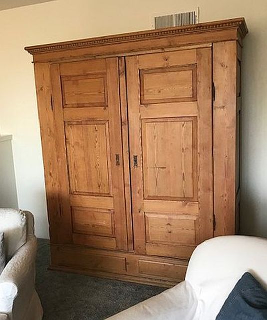 armoire with a weathered wood finish