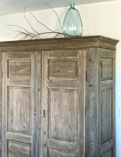 armoire with a weathered wood finish