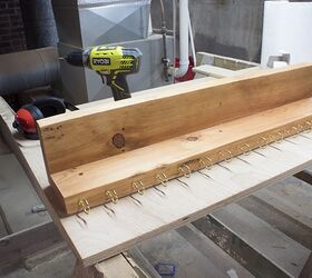 Screw 15 cup hooks into scrap wood for this bedroom storage idea