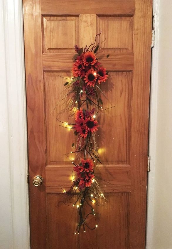 s 20 fall friendly ways to decorate your home with flowers, Craft an Autumn Sunflower Door Hanger