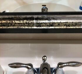 get rid of dark spots on frame of bathroom mirror