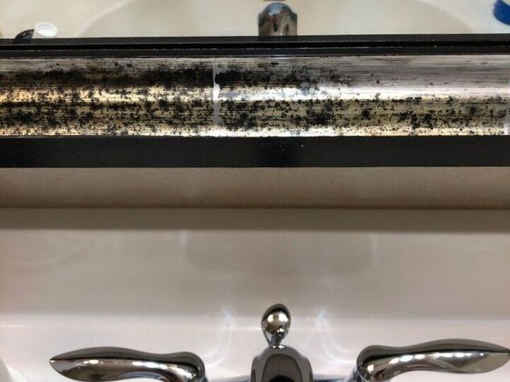q get rid of dark spots on frame of bathroom mirror