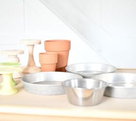 Stack thrifted pans and plates on flower pots for beautiful countertop storage