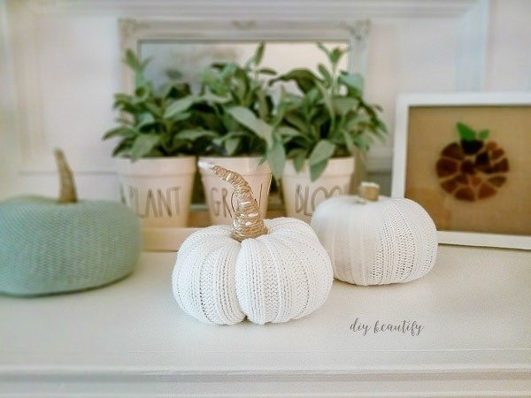 s 13 ways to decorate for fall using items you probably already own, Sweater Sleeve Pumpkins