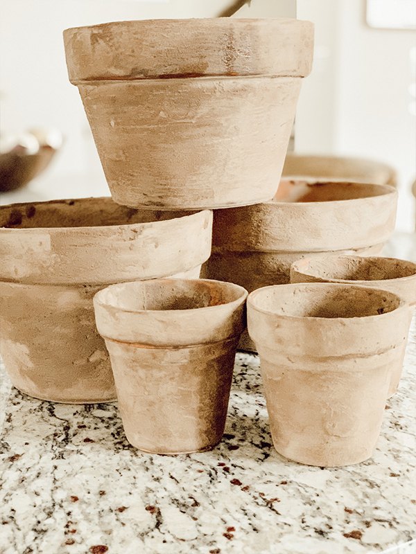 s 13 ways to decorate for fall using items you probably already own, Antique Looking Flower Pots