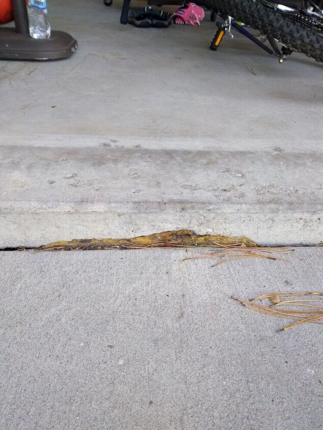 q how should i handle gap and erosion of garage slab