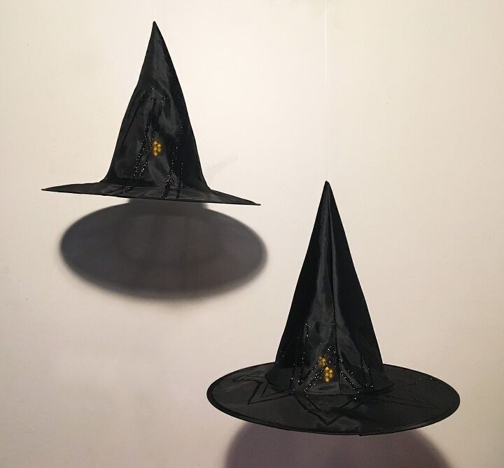 s 12 spooky halloween ideas everyone s copying this year, Hanging Witch s Hat Luminaries