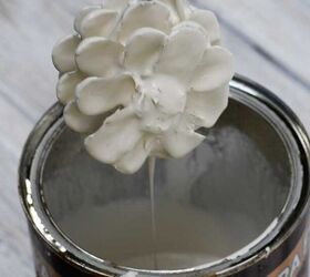 Dip pine cones in white paint for this beautiful and unexpected decor idea