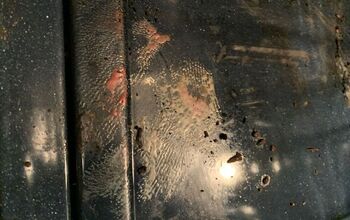 How to remove melted micro fiber towel from the bottom of my stove?