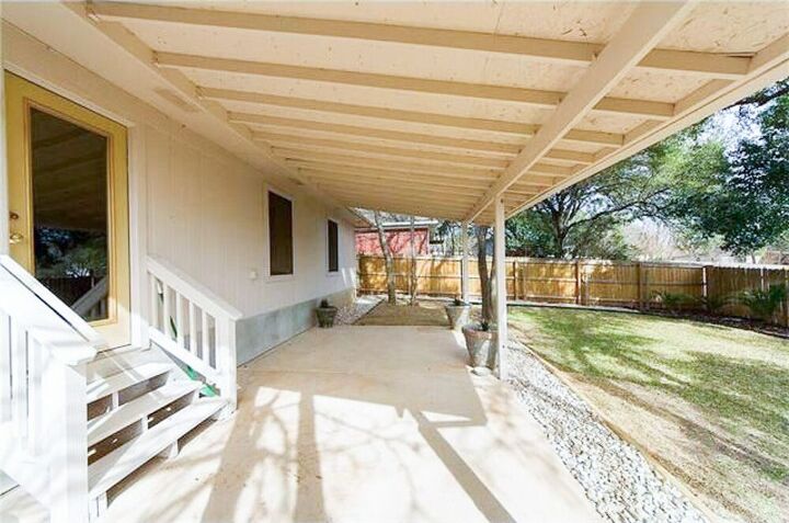 an inexpensive ikea patio makeover with outdoor curtains