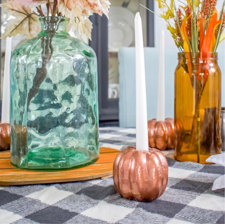 s 20 ways to sprinkle autumn colors throughout your home, Turn cheap foam pumpkins into seasonal candlestick holders