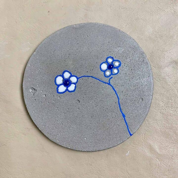 diy concrete coasters with a flower design