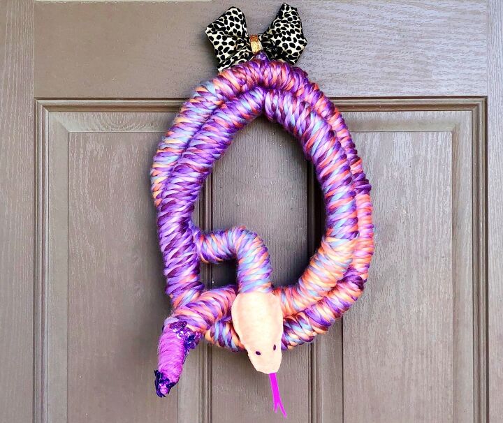 s 15 chic and spooky front door decor ideas for halloween, DIY a snake for your door from yarn