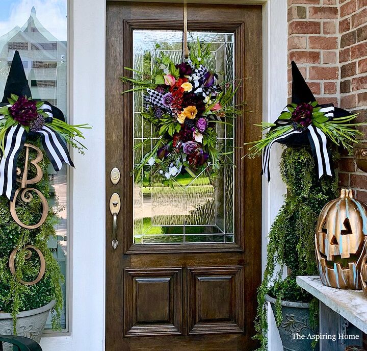 s 15 chic and spooky front door decor ideas for halloween, Beautify your door with a whimsical Halloween floral arrangement