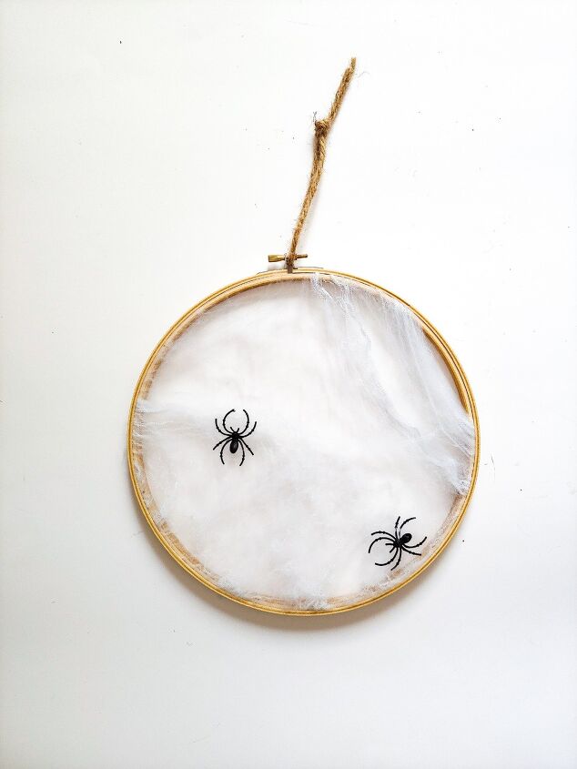 s 15 chic and spooky front door decor ideas for halloween, DIY a spider web wreath from a wooden embroidery hoop
