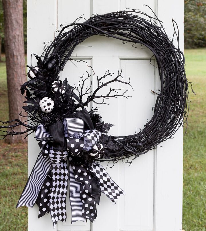 s 15 chic and spooky front door decor ideas for halloween, Decorate your door with a whimsical Halloween wreath