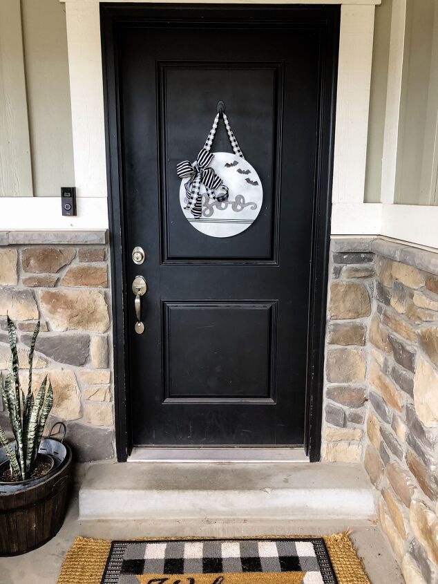 s 15 chic and spooky front door decor ideas for halloween, Welcome visitors with a wooden Halloween sign