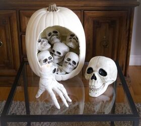 s 21 amazing pumpkin ideas you need to see before halloween, Stuff a pumpkin with skulls for a super easy project